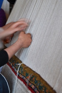 Women Weaving A Carpet